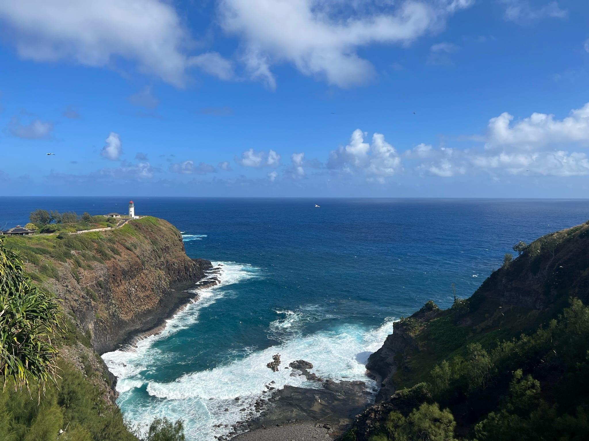 Kilauea Lighthouse viewed across the cove on Kauai's North Shore, an open-ocean scene near Princeville