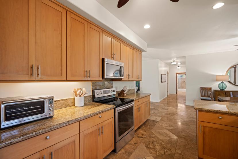 Stainless oven and granite counters in Emmalani Hale kitchen