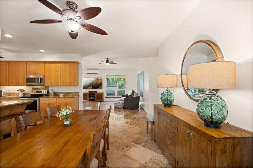 Dining area opening into living room at Emmalani Hale, Princeville
