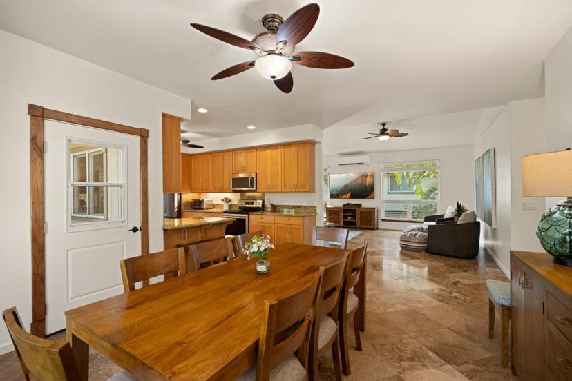 Open-concept dining, kitchen, and living room at Princeville vacation home