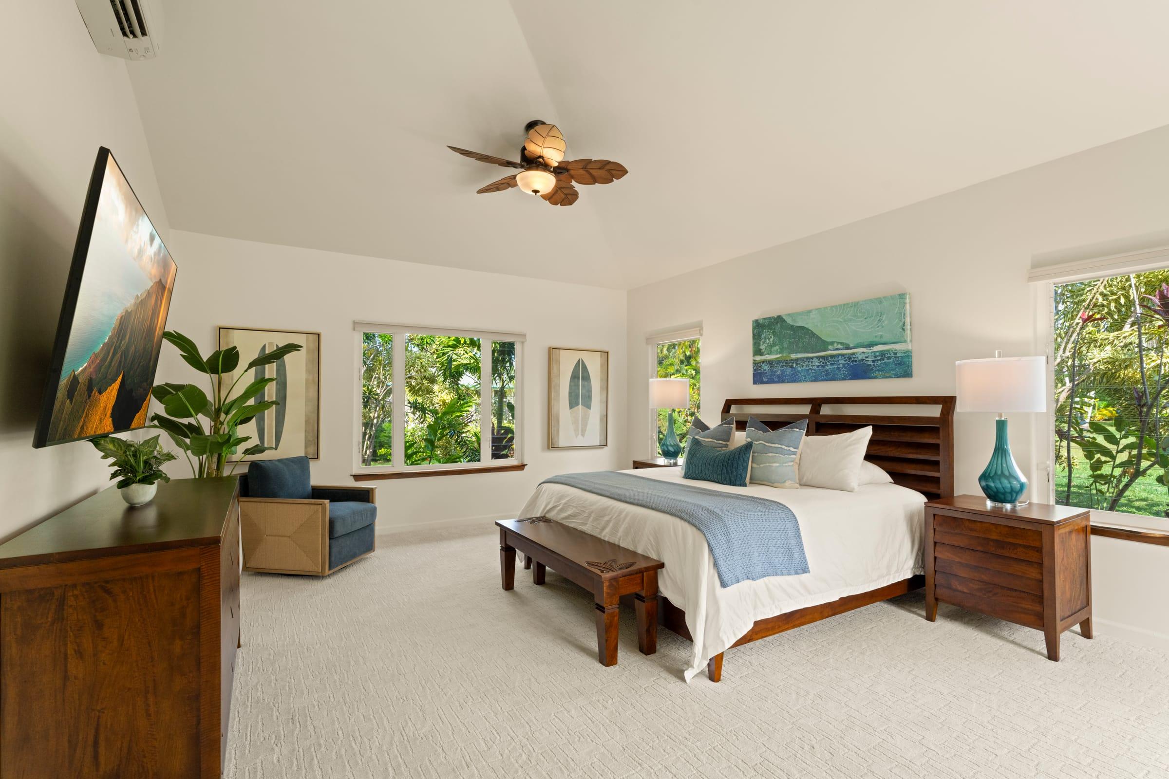 Master bedroom with king bed and whole-home central AC at Emmalani Hale, a Princeville Kauai rental