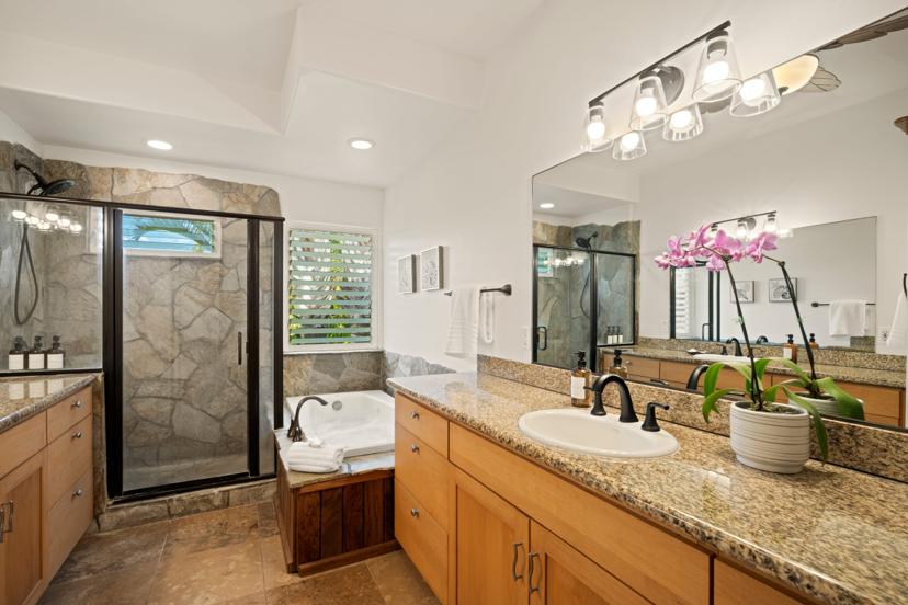 Master bathroom with dual vanity, soaking tub, and stone walk-in shower at Hale