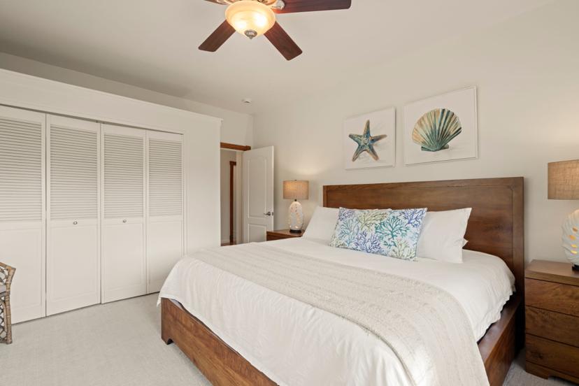 King guest bedroom with louvered closet at Emmalani Hale Kauai