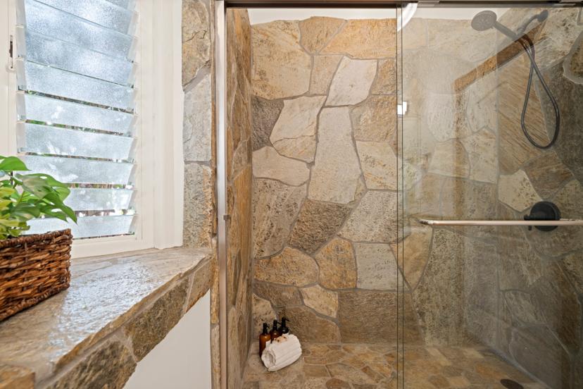Stone-tile walk-in shower detail at Princeville Kauai vacation rental