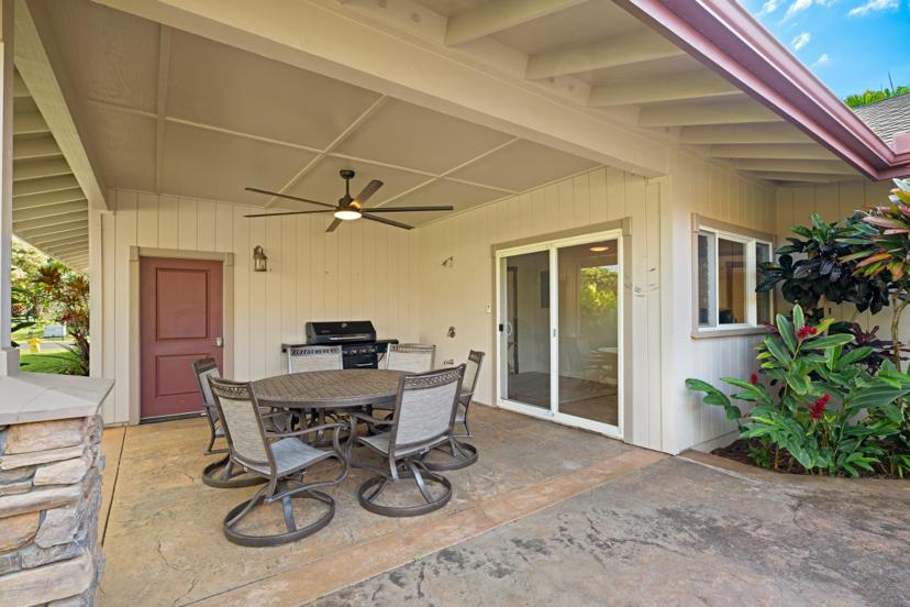 Outdoor lanai dining area with gas grill at Emmalani Hale Kauai