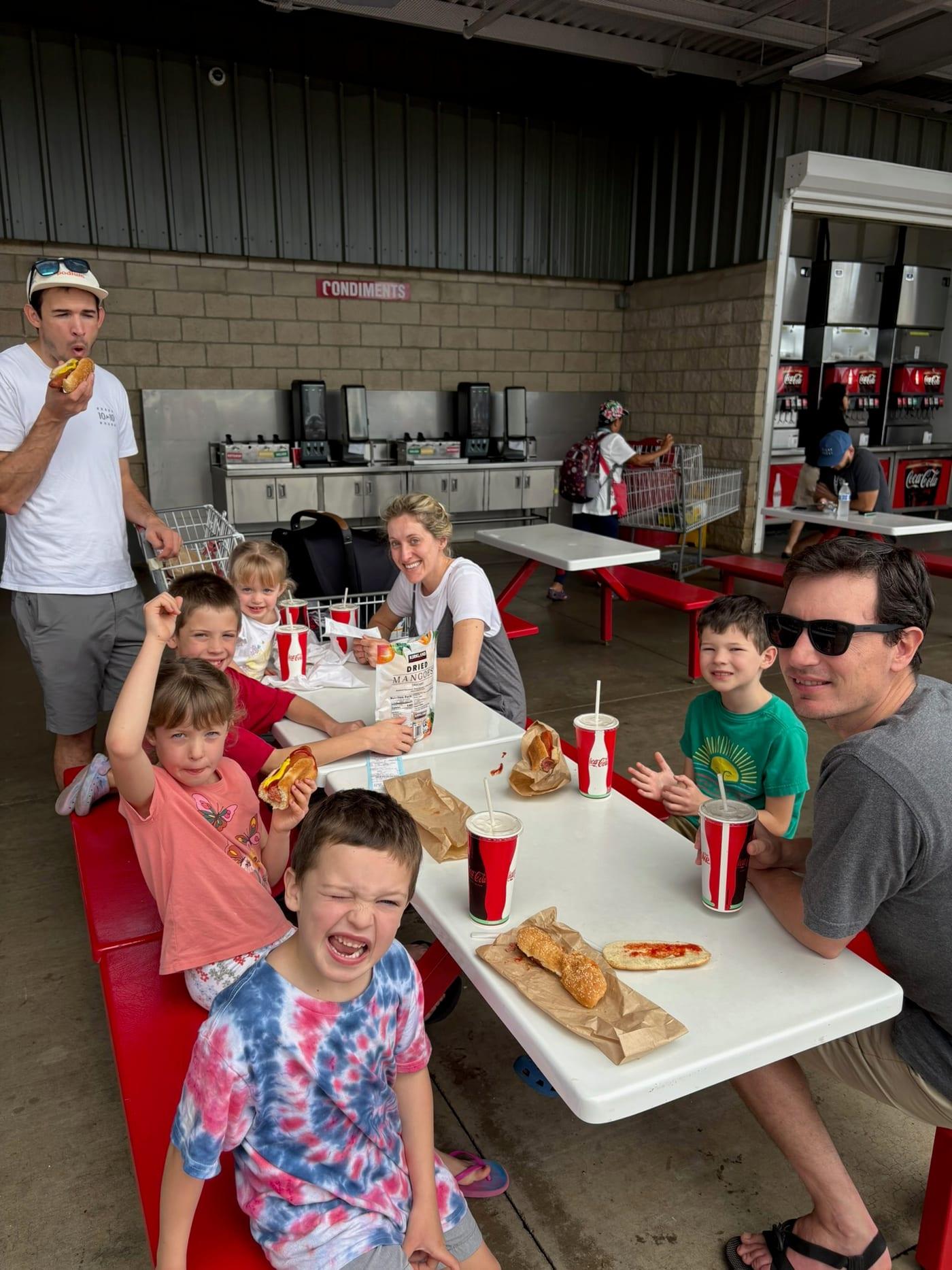 Family grabbing a casual food stop after arrival in Kauai, a reminder that some bulky food items are easier to buy on island